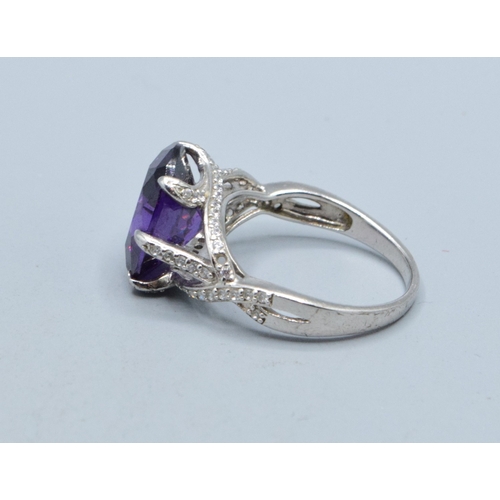 295 - 925 silver ladies Amethyst design single stone ring with a triple cross over setting size R
