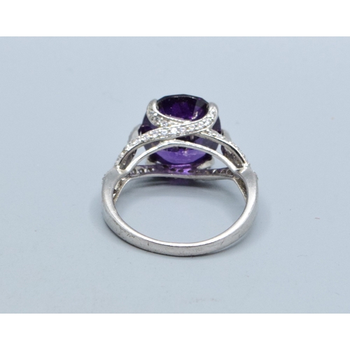 295 - 925 silver ladies Amethyst design single stone ring with a triple cross over setting size R