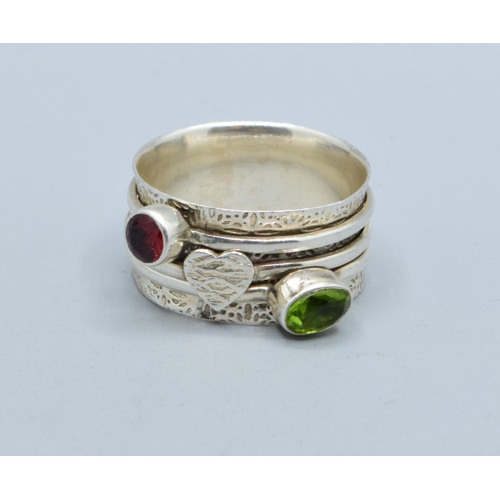 297 - 925 silver ladies triple slider design ring showing Peridot and Garnet with a heart making the third... 
