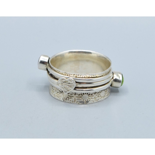 297 - 925 silver ladies triple slider design ring showing Peridot and Garnet with a heart making the third... 