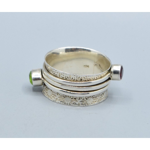 297 - 925 silver ladies triple slider design ring showing Peridot and Garnet with a heart making the third... 