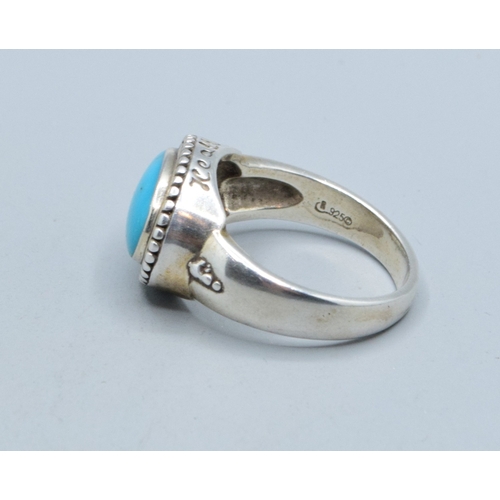 306 - 925 silver ladies vintage oval Turquoise ring in an enclosed scroll setting size T&nbsp;