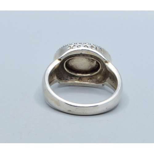 306 - 925 silver ladies vintage oval Turquoise ring in an enclosed scroll setting size T&nbsp;