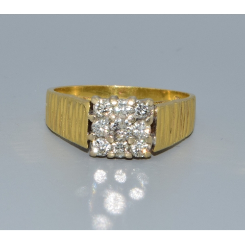 338 - 18ct gold Diamond square face ring being set with 9 Diamonds the central one slightly larger for eff... 