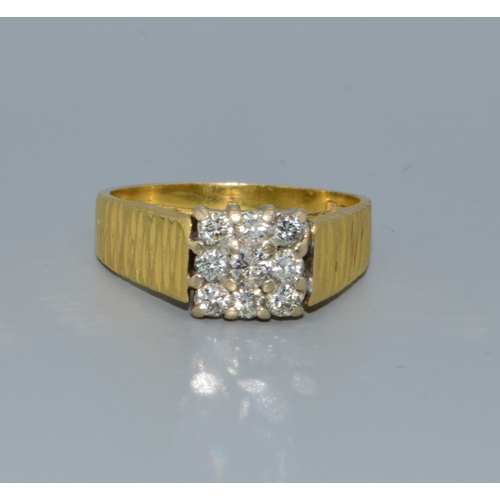 338 - 18ct gold Diamond square face ring being set with 9 Diamonds the central one slightly larger for eff... 