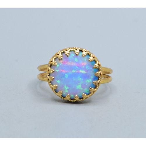 328 - Round Opal ladies vintage dress ring set in 9ct gold (tested) claw mount the head measures 13mm diam... 