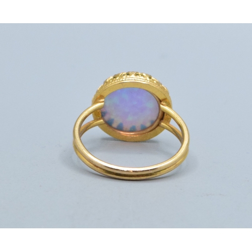 328 - Round Opal ladies vintage dress ring set in 9ct gold (tested) claw mount the head measures 13mm diam... 
