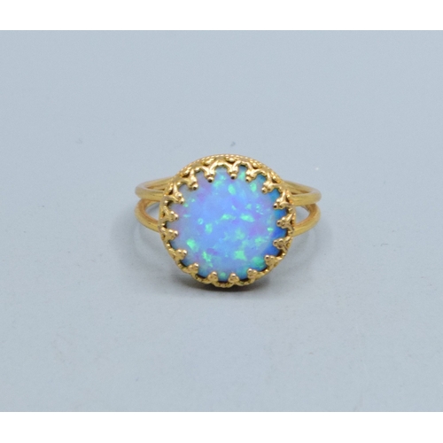 328 - Round Opal ladies vintage dress ring set in 9ct gold (tested) claw mount the head measures 13mm diam... 