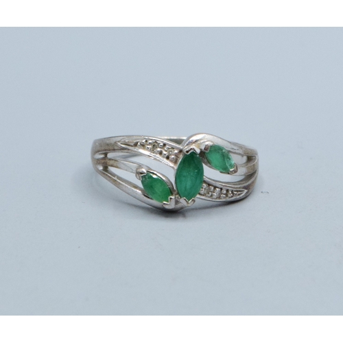 330 - 9ct white gold ladies Emerald and Diamond double sweep design ring size N, 3.4grams&nbsp;