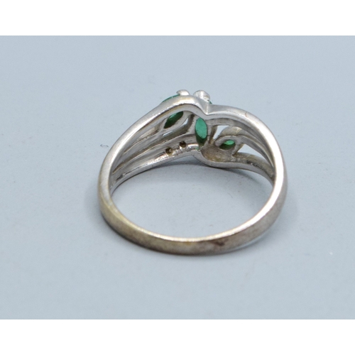 330 - 9ct white gold ladies Emerald and Diamond double sweep design ring size N, 3.4grams&nbsp;