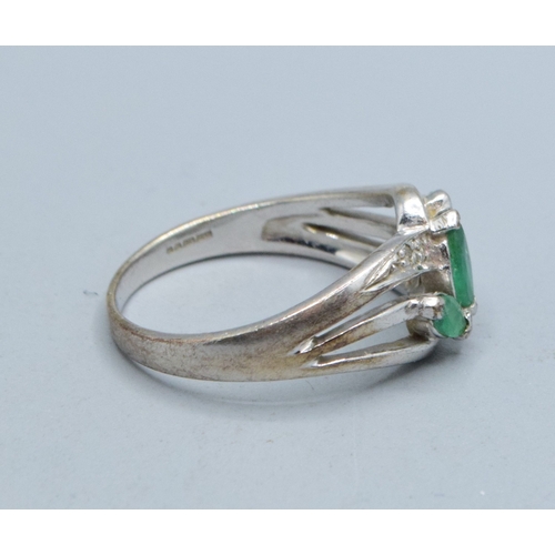 330 - 9ct white gold ladies Emerald and Diamond double sweep design ring size N, 3.4grams&nbsp;