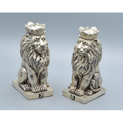 224 - Unusual pair of silver plate condiments in the shape of Lions on a Plinth 9cm tall