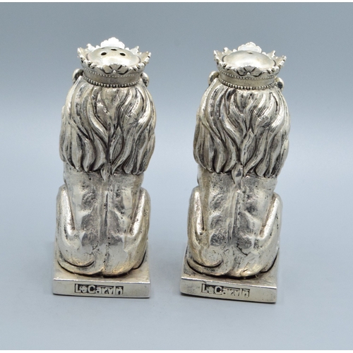 224 - Unusual pair of silver plate condiments in the shape of Lions on a Plinth 9cm tall