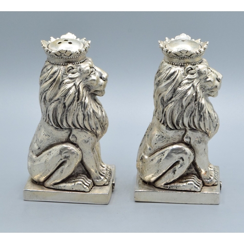 224 - Unusual pair of silver plate condiments in the shape of Lions on a Plinth 9cm tall