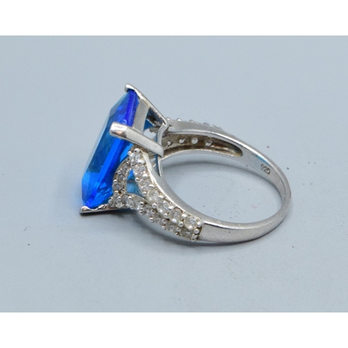246 - 925 silver ladies oblong shape Blue Topaz central stone with clear gem stone side decoration stateme... 