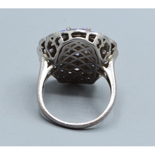296 - Large oval Amethyst ladies statement ring set in an open work design in 925 silver the head size bei... 