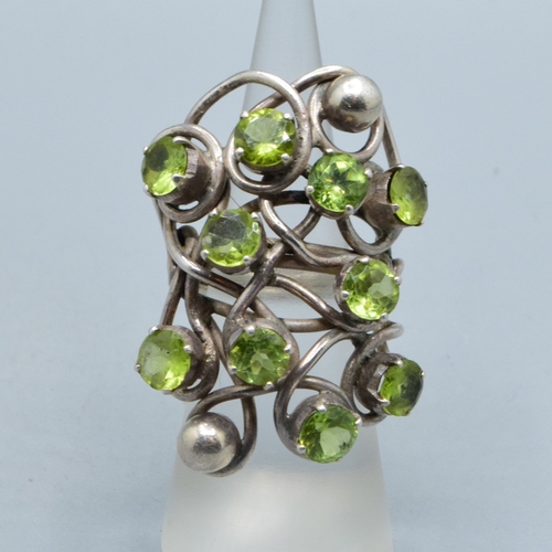 300 - Very large ladies Peridot multi stone statement ring held in an open design in 925 silver, the head ... 