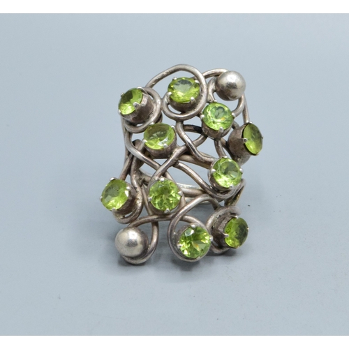 300 - Very large ladies Peridot multi stone statement ring held in an open design in 925 silver, the head ... 