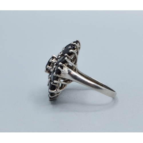 313 - 925 silver ladies Sapphire cluster statement ring held in a claw design the head being 25mm diameter... 