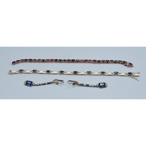 764 - Vintage sterling silver garnet line bracelet, together with a pair of art Deco drop paste earrings (... 