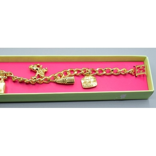 789 - Vintage original Escada boxed charm bracelet together with an old gold plated padlock bracelet weigh... 