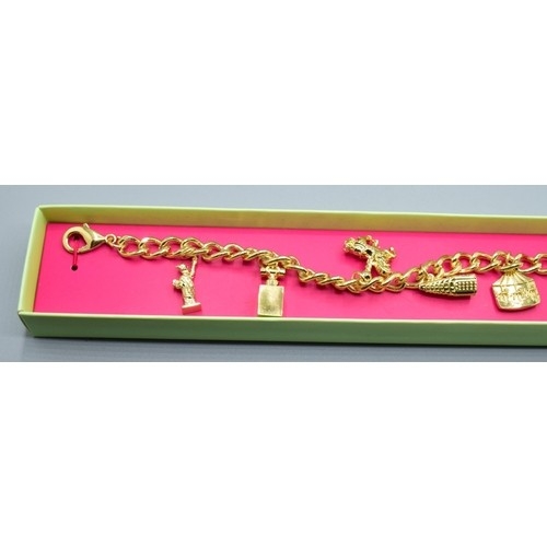 789 - Vintage original Escada boxed charm bracelet together with an old gold plated padlock bracelet weigh... 