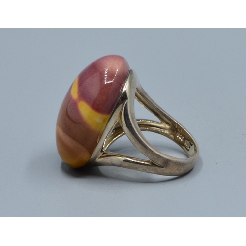 863 - 925 silver large oval Mookaite Jasper ladies dress ring with the single stone being 27x21x15mm held ... 