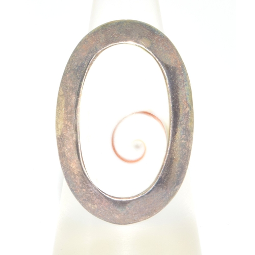 820 - 925 silver large oval white stone with centre twist design held in an enclosed setting size M