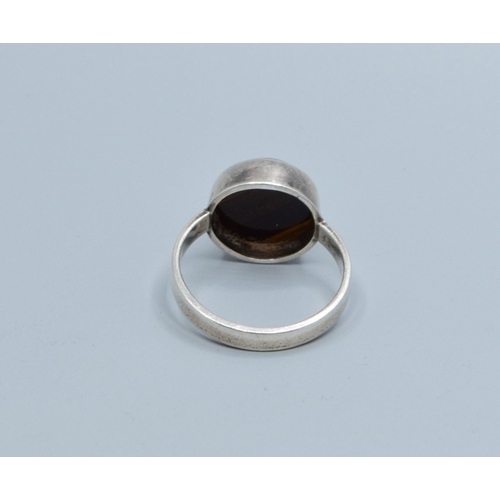 831 - 925 silver Tigers Eye solitaire ring held in an enclosed setting size M