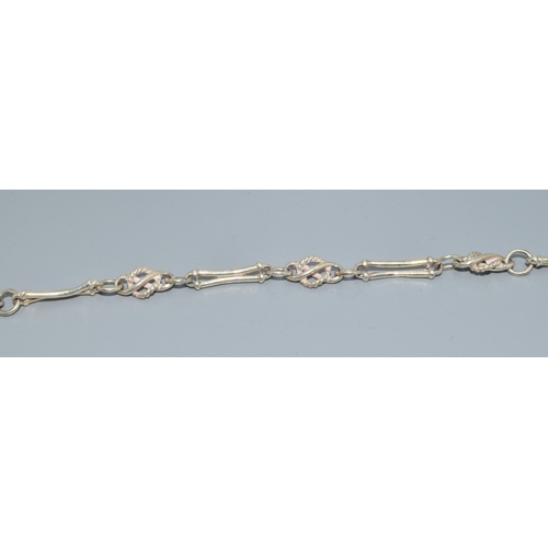 762 - 925 silver fancy link bracelet 19cm long together a pair of drop earrings and a ring
