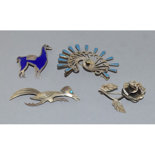 819 - Collection of native silver brooches to include Navajo and Taxco