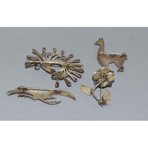 819 - Collection of native silver brooches to include Navajo and Taxco