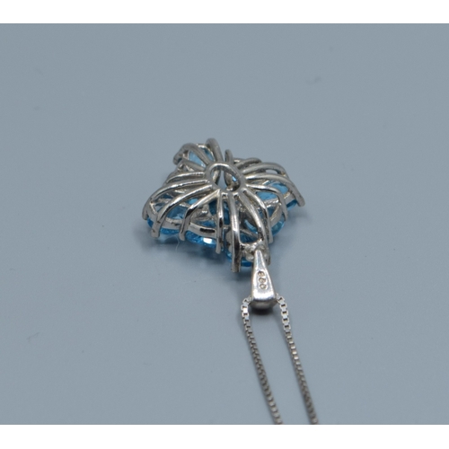 837 - New with Tag 925 silver ladies Blue topaz pendant neck lace in a diamond shape on a new 925 silver c... 