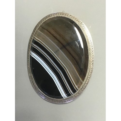 874 - Two Antique Scottish Brooches, 1 x Banded Agate and White Metal Mounted the other a Pebble Brooch in... 