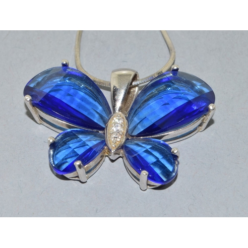 864 - 2 x 925 silver pendant necklaces a Butterfly pend and chain together with a green stone pendant and ... 