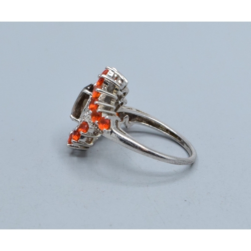771 - Superior 925 silver ladies Grossular Garnet and accent Diamond large halo sweep ring with a central ... 