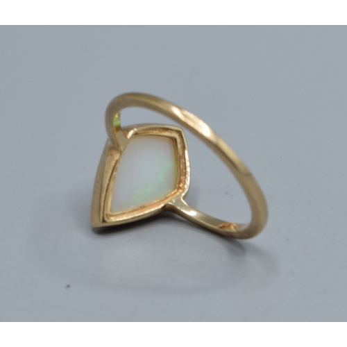 925 - 9ct gold ladies Diamond shape Opal single stone ring held in an enclosed design the mead measures 14... 