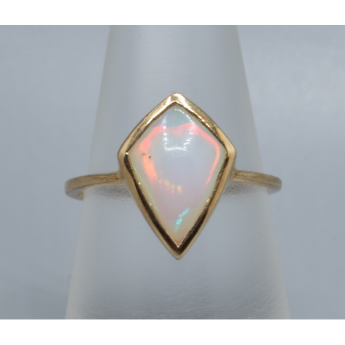 925 - 9ct gold ladies Diamond shape Opal single stone ring held in an enclosed design the mead measures 14... 