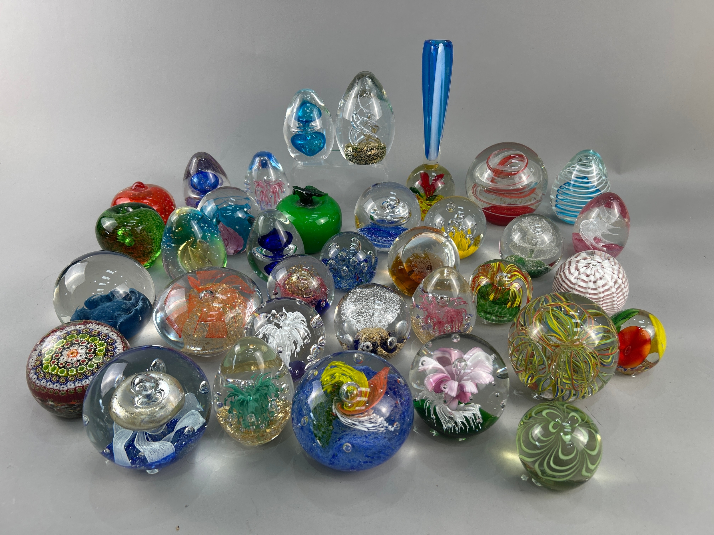 A large Collection of glass paperweights.