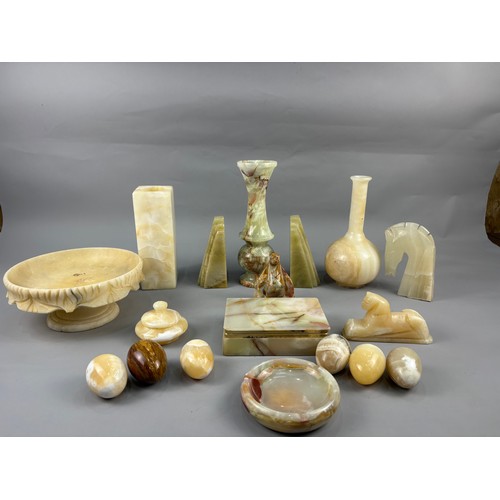 A collection of onyx and alabaster items