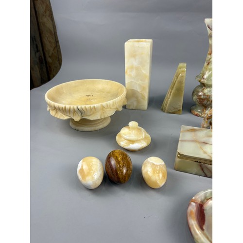 A collection of onyx and alabaster items