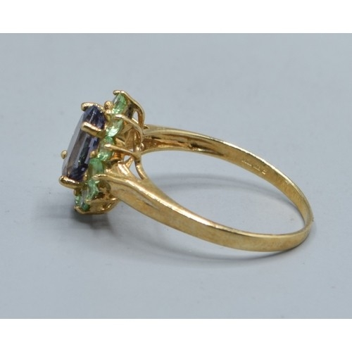 544 - 9ct gold ladies Amethyst and green Peridot halo design ring size N, 2.2grams