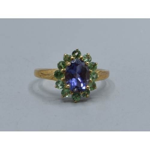 544 - 9ct gold ladies Amethyst and green Peridot halo design ring size N, 2.2grams