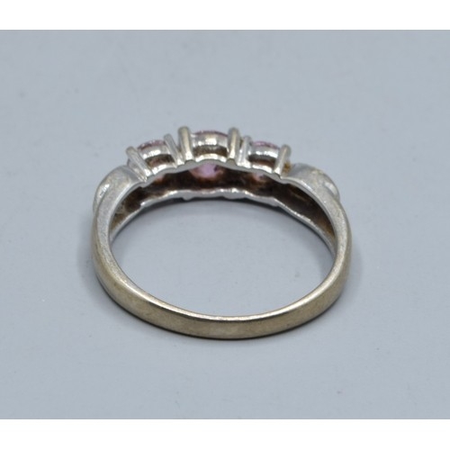 548 - 9ct white gold Pink sapphire and accent Diamond decorated 3 stone ring size N, 2.5grams