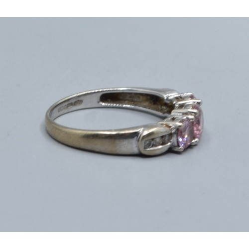 548 - 9ct white gold Pink sapphire and accent Diamond decorated 3 stone ring size N, 2.5grams
