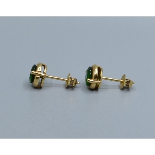525 - 9ct gold Diopside stud earrings held in an enclosed claw setting 7mm diameter