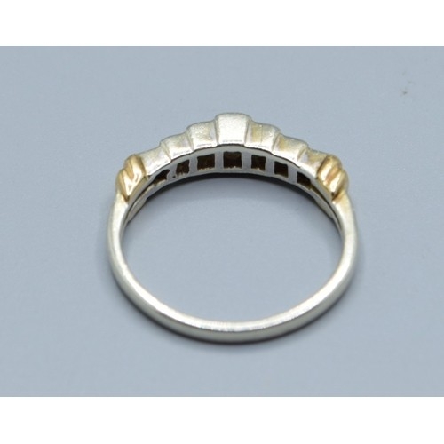 545 - 9ct gold ladies 7 stone Diamond ring in a stepped design and hallmarked as 0.25cts in an enclosed se... 