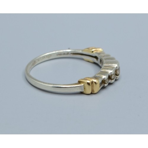 545 - 9ct gold ladies 7 stone Diamond ring in a stepped design and hallmarked as 0.25cts in an enclosed se... 