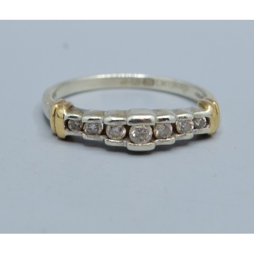 545 - 9ct gold ladies 7 stone Diamond ring in a stepped design and hallmarked as 0.25cts in an enclosed se... 
