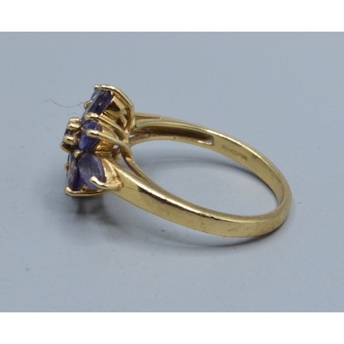554 - 9ct gold ladies Amethyst star burst design ring size N, 3.33grams